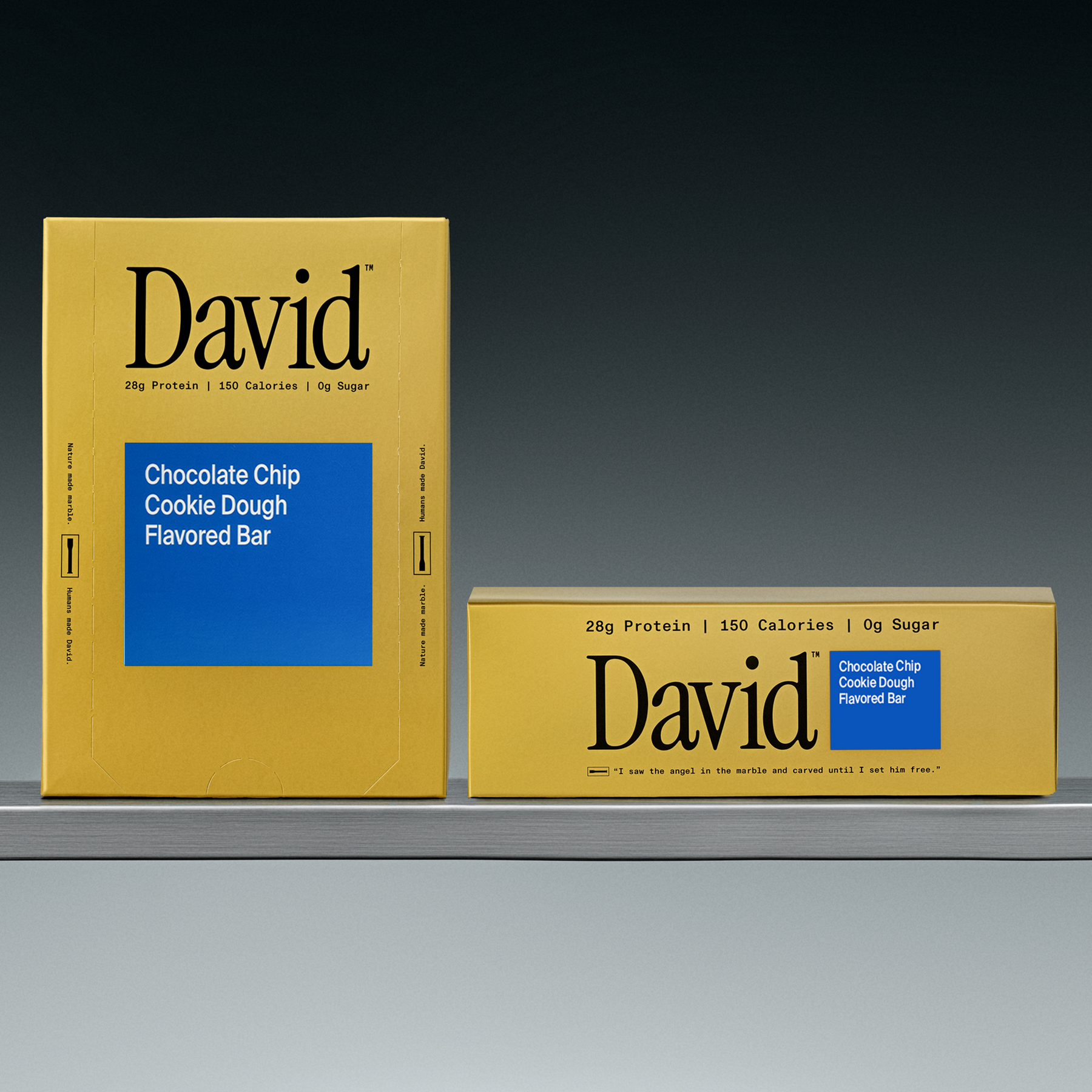 Two David chocolate chip cookie dough flavored bars on a gray shelf with a black background